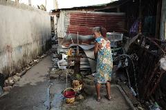 Woman using water pomp